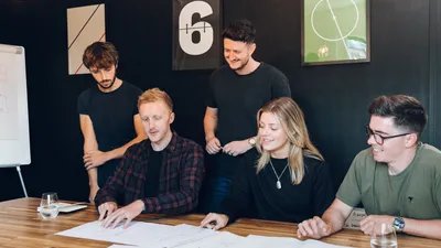 Close up of the team going over a brief